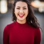 Smiling women in her red sweatshirt